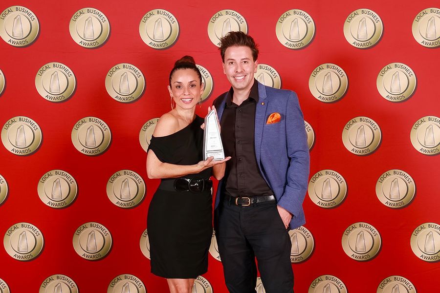 Dr Andrea Arenas receiving the Local Business Award