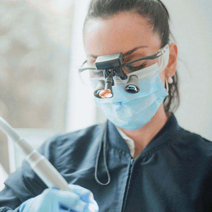 Our dentist at work with precision loupes