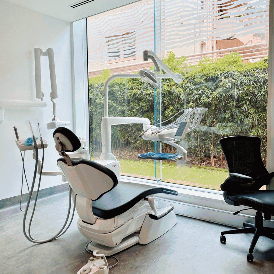 A treatment room at The Warm Smile overlooking greenery